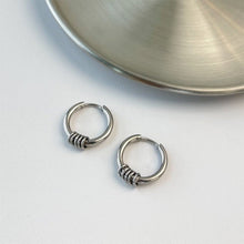 Load image into Gallery viewer, Hoop earrings made of solid surgical steel with circle rings, available in 15mm or 17mm sizes. Hypoallergenic and safe for sensitive ears. Ideal for everyday wear or special occasions.