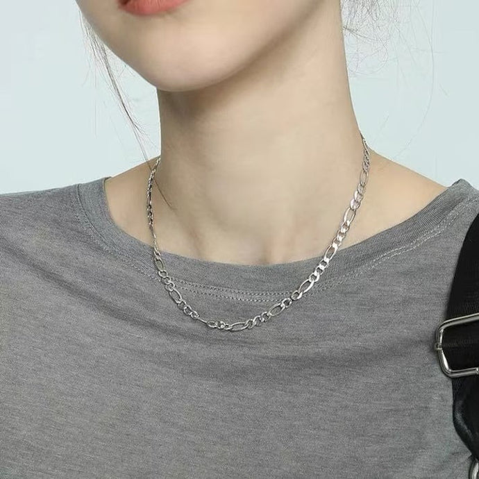 Minimalist solid stainless steel necklace with a trendy Figaro chain design, adjustable 16-18 inches, hypoallergenic and stylish.