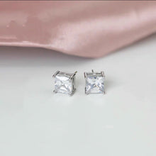 Load image into Gallery viewer, Princess cut cubic zirconia stud earrings in 316 surgical steel, available in 3mm, 5mm, and 7mm sizes.
