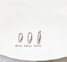 Load image into Gallery viewer, Hoop earrings made from 316 surgical steel, available in 8mm, 10mm, or 12mm sizes.
