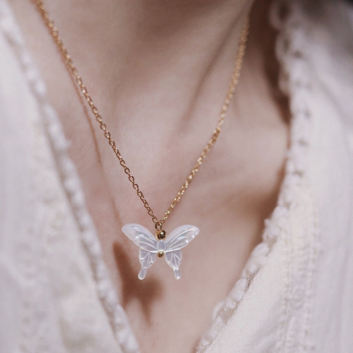 18K gold plated necklace featuring a mother of pearl butterfly pendant, adjustable between 16 and 18 inches.