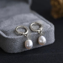 Load image into Gallery viewer, Minimalist 18K gold plated or silver plated hoop earrings with 5mm and 8mm AAA oval freshwater pearls in a huggie style.
