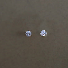 Load image into Gallery viewer, A pair of 14K solid gold stud earrings with cubic zirconia stones available in 3mm, 4mm, and 5mm sizes.
