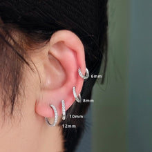 Load image into Gallery viewer, Hoop earrings made from 316 surgical steel, available in 8mm, 10mm, or 12mm sizes.
