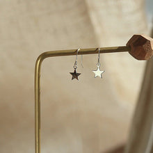 Load image into Gallery viewer, 18K gold plated dangle earrings with 8mm star charms, hypoallergenic and elegant.
