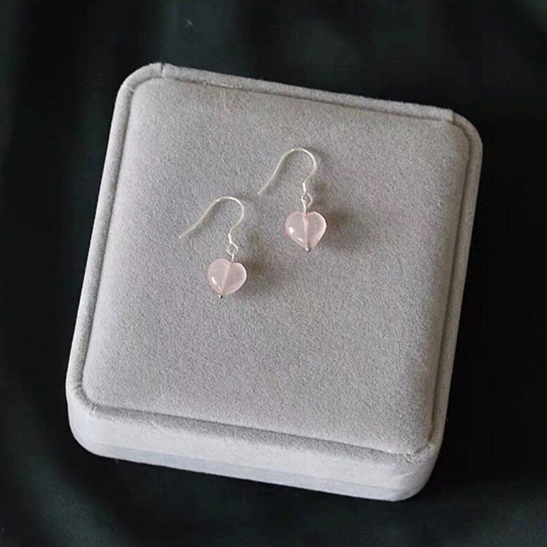  S925 sterling silver 8mm dangle rose quartz earrings, showcasing a delicate and captivating design perfect for adding a touch of elegance to any ensemble.