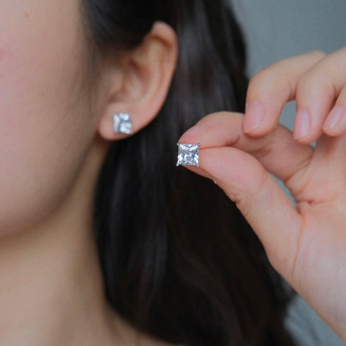 Princess cut cubic zirconia stud earrings in 316 surgical steel, available in 3mm, 5mm, and 7mm sizes.