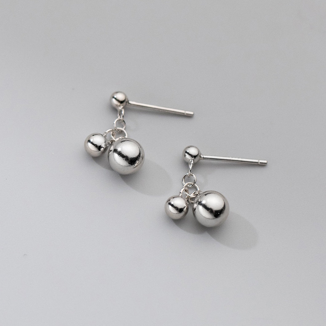 Surgical stainless steel earrings with 6mm and 3mm metal bead design, modern and versatile, hypoallergenic.