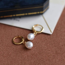 Load image into Gallery viewer, Minimalist 18K gold plated or silver plated hoop earrings with 5mm and 8mm AAA oval freshwater pearls in a huggie style.
