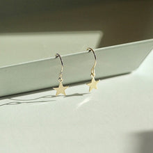 Load image into Gallery viewer, 18K gold plated dangle earrings with 8mm star charms, hypoallergenic and elegant.
