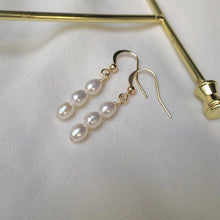 Load image into Gallery viewer, Minimalist dainty earrings with 5mm freshwater pearl bar design, gold plated, hypoallergenic and elegant.
