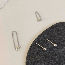 Load image into Gallery viewer, Asymmetrical Korean fashion stud earrings with a 2cm stud and a 3cm chain detail, made from high-quality steel. Inspired by K-Pop star style.
