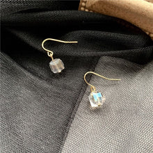 이미지를 갤러리 뷰어에 로드 , A pair of 18K gold plated dangle earrings featuring 6mm sugar cube clear AB beads with an iridescent finish.
