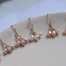 Load image into Gallery viewer, 18K gold dangle earrings with 4mm AAA grade oval freshwater pearls, available in white, purple, or peach. Elegant and sophisticated design.
