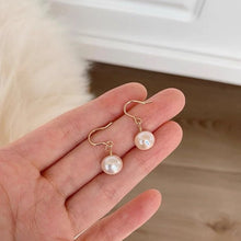 Load image into Gallery viewer, 18K gold plated or steel dangle earrings with 8-8.5mm freshwater AAA off round white pearls, perfect for adding a touch of timeless beauty and sophistication to any outfit.
