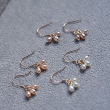 Load image into Gallery viewer, 18K gold dangle earrings with 4mm AAA grade oval freshwater pearls, available in white, purple, or peach. Elegant and sophisticated design.
