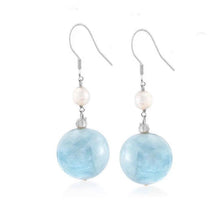 Load image into Gallery viewer, Dangle earrings with 12mm aquamarine round bead and 4-5mm natural pearls. Available in gold or silver, with a sophisticated design suitable for any occasion.
