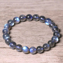 Load image into Gallery viewer, A bracelet made of AAA labradorite round beads in 6mm and 8mm sizes, showcasing stunning iridescence and color play, with a stretchy design for a comfortable fit.
