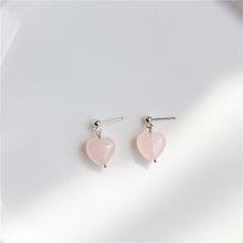 Load image into Gallery viewer, Earrings with 10mm Mozambique heart rose quartz, available in 18K gold-plated or silver stainless steel settings. Hypoallergenic and stylish.
