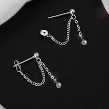 Load image into Gallery viewer, Steel earrings with natural button pearls and a tiny bead chain, 3cm in length, perfect for adding a touch of sophistication to any outfit.
