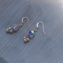 Load image into Gallery viewer, A pair of 18K Gold Plated S925/Silver S925 dangle earrings with clear Aurora Borealis faceted Austrian beads and 3mm natural pearls.
