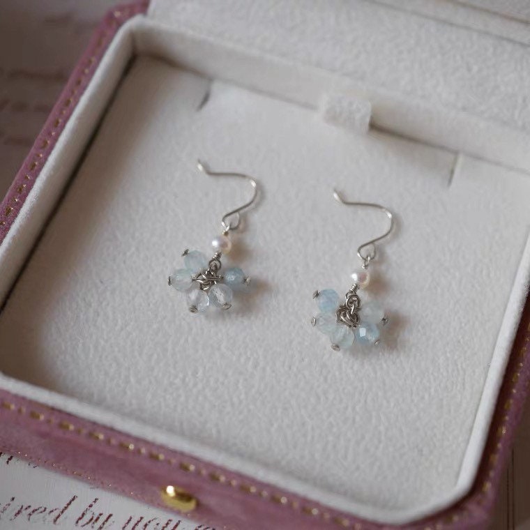 A pair of 18K Gold Plated or surgical steel stud earrings with AAA 4-5mm small oval natural pearls.