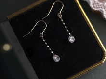 Load image into Gallery viewer, A pair of elegant dangle drop earrings made of surgical steel with small chains and cubic zirconia stones, available in 5mm and 8mm sizes, showcasing a sophisticated and modern design.
