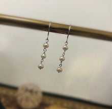 Load image into Gallery viewer, 18K gold plated, silver, or surgical steel dangle earrings with 4mm baroque pearls, perfect for adding an organic and elegant touch to any outfit.
