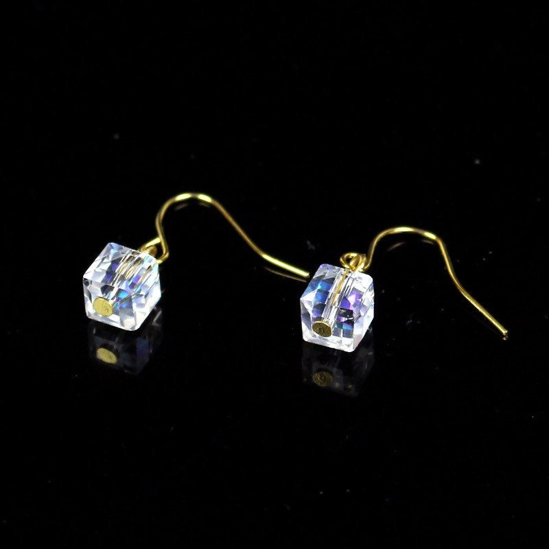 A pair of 18K gold plated dangle earrings featuring 6mm sugar cube clear AB beads with an iridescent finish.