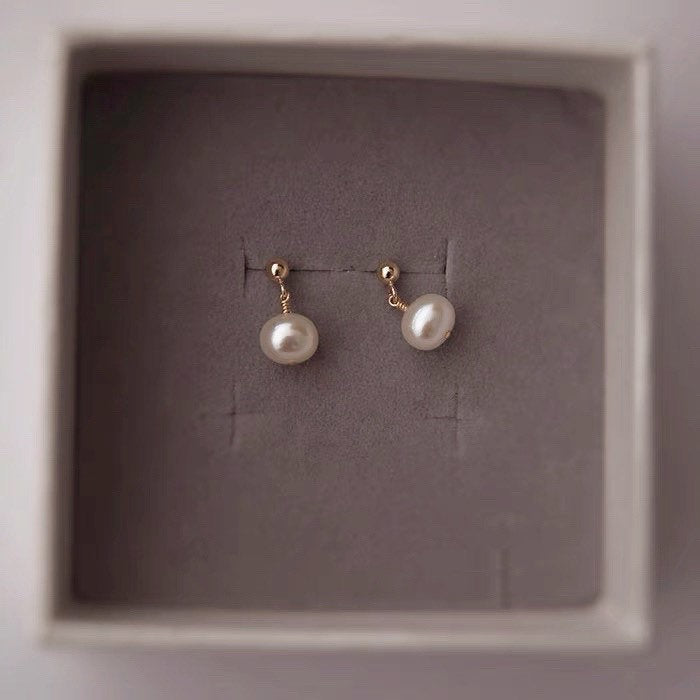 Image of 18K Gold Plated Small Button Freshwater Pearl Earrings with 4-5mm pearls, perfect for adding elegance to any outfit.