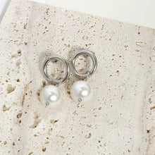 Load image into Gallery viewer, Stainless steel circle stud earrings with 13mm diameter and 8mm crystal pearls. Elegantly designed for a classic yet contemporary look.
