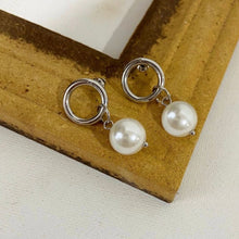 Load image into Gallery viewer, Stainless steel circle stud earrings with 13mm diameter and 8mm crystal pearls. Elegantly designed for a classic yet contemporary look.
