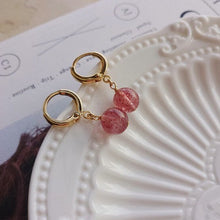 Load image into Gallery viewer, 18K gold plated huggie hoop earrings with AAA-grade natural strawberry quartz 8mm beads, perfect for adding a touch of elegance and femininity to any outfit.
