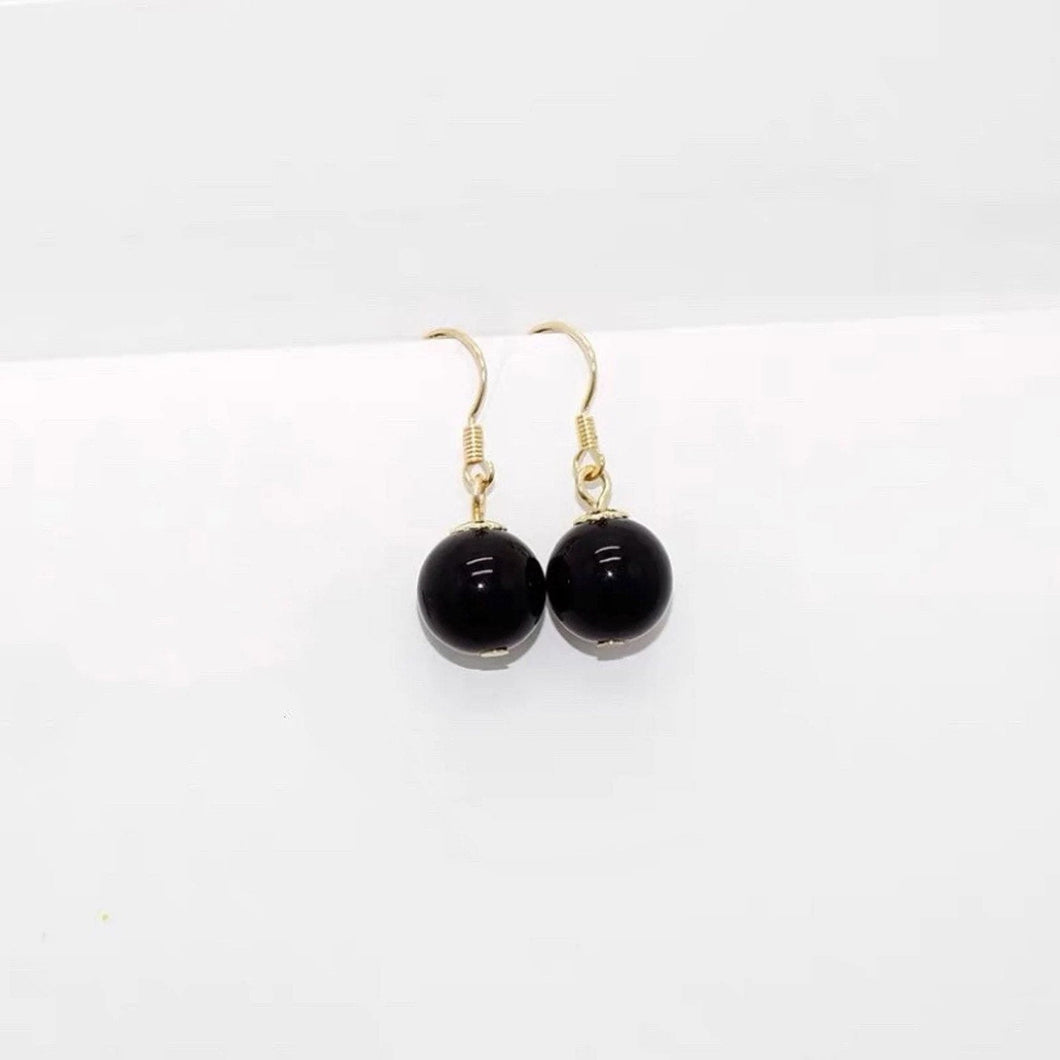 18K gold plated 925 silver dangle earrings with a filigree flower design and 8mm black obsidian beads, perfect for adding a striking and sophisticated touch to any outfit.