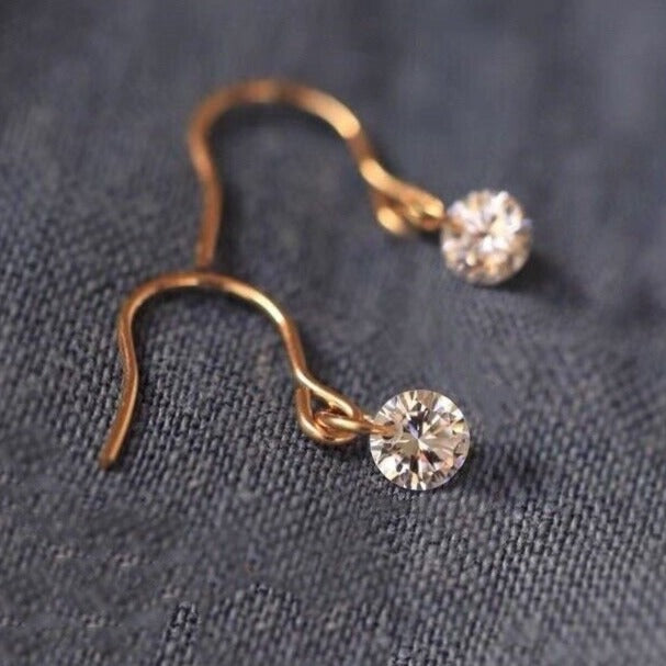 Pair of mini, small, and dainty single earrings featuring 5mm AAAA cubic zirconia dangles, available in gold, silver, or steel.