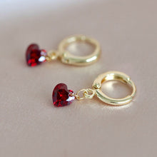 Load image into Gallery viewer, Hoop earrings plated with 18K gold, featuring 6mm garnet red cubic zirconia stones and a lever-back closure. Dainty and minimalist, perfect for bridesmaid jewelry or a Valentine&#39;s Day gift.
