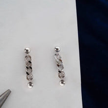 Load image into Gallery viewer, Pair of double piercing earrings made of solid stainless steel, featuring 5mm Cuban chain studs
