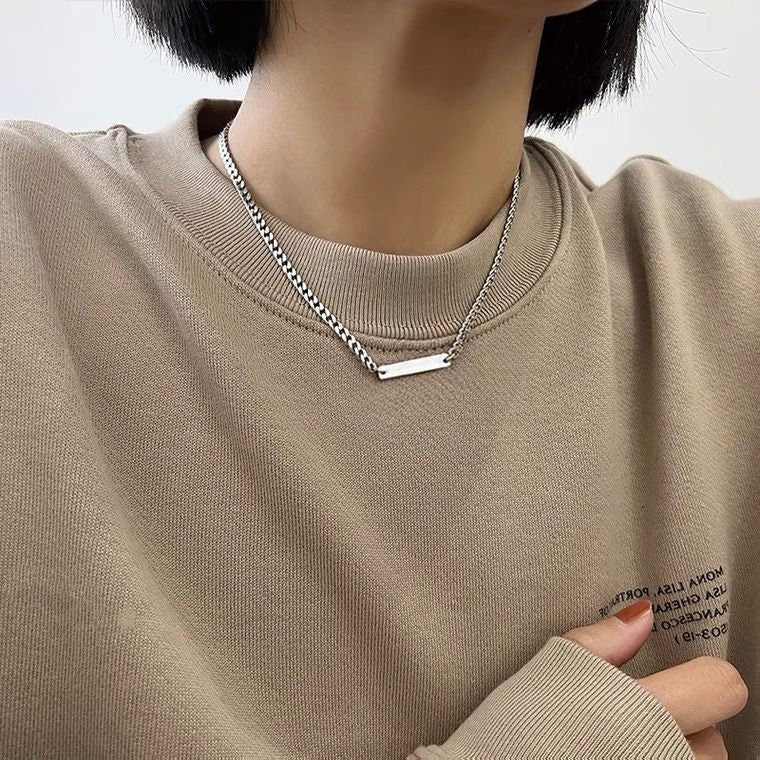 Solid steel Korean K-pop style necklace with a 2mm chunky chain and 2.5cm rectangle charm, adjustable from 16 to 18 inches, perfect for adding a trendy K-pop flair to your outfit.