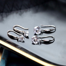 Load image into Gallery viewer, A pair of 925 sterling silver hook earrings featuring cubic zirconia stones, available in 5mm and 8mm sizes, showcasing a brilliant and elegant design.
