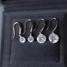 Load image into Gallery viewer, A pair of 925 sterling silver hook earrings featuring cubic zirconia stones, available in 5mm and 8mm sizes, showcasing a brilliant and elegant design.
