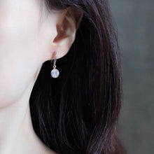 Load image into Gallery viewer, A pair of 925 sterling silver hook earrings featuring cubic zirconia stones, available in 5mm and 8mm sizes, showcasing a brilliant and elegant design.
