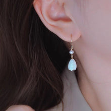 Load image into Gallery viewer, 18K gold plated dangle earrings featuring 8-9mm natural mother of pearl white champaca flowers, perfect for adding elegance and sophistication to any outfit.
